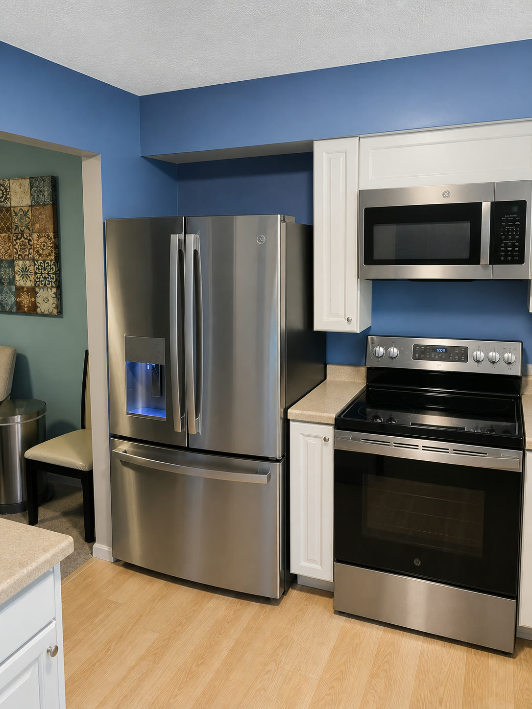 Tom Builders completed kitchen upgrade with fitted cabinetry and stainless-steel appliances