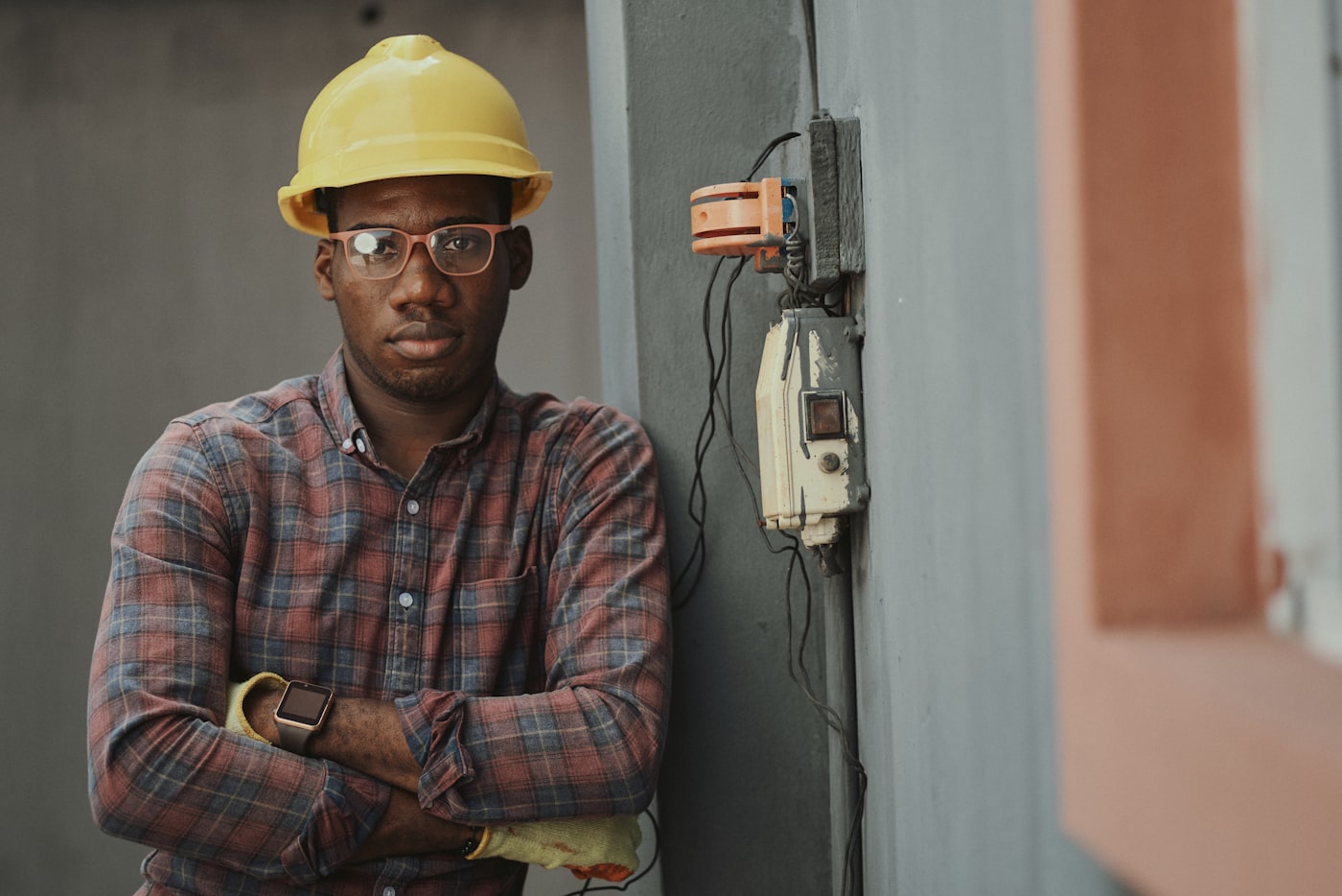 Electrician completing electrical installation work inside a property