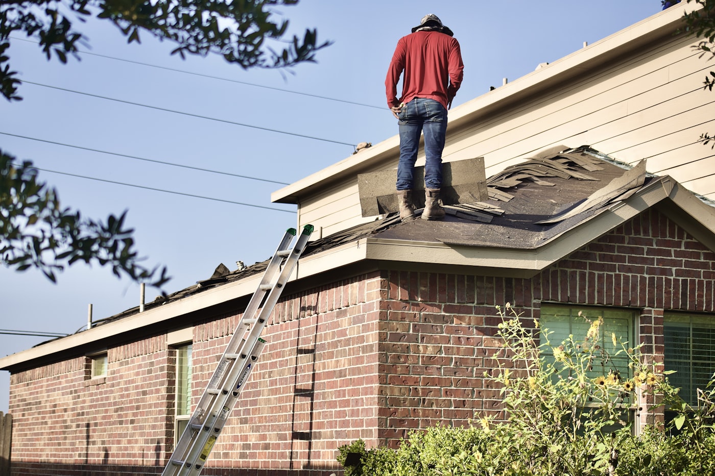 Roofing contractor working on a residential roof